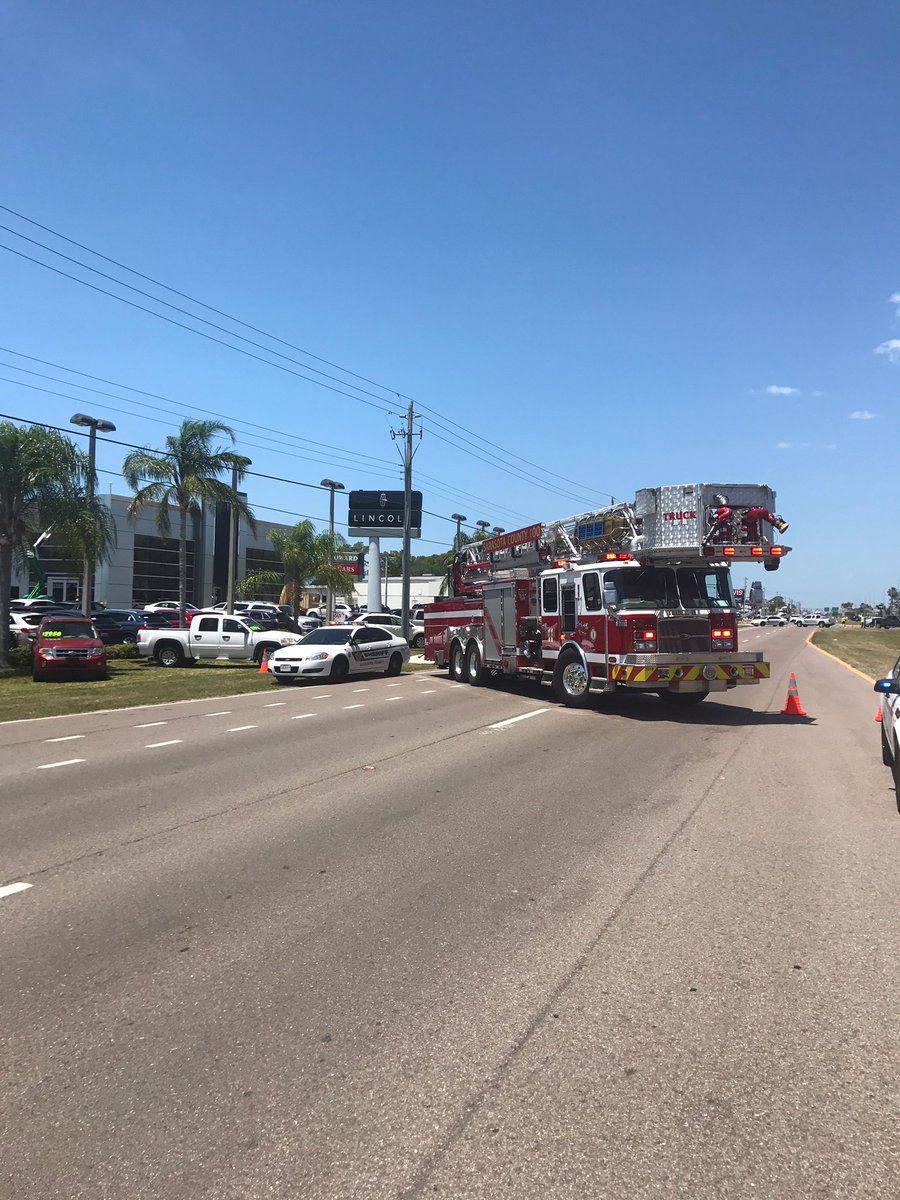 Power lines down across US 41. All lanes blocked. Avoid the area 